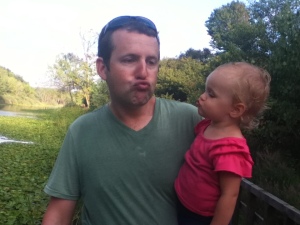 Scott is teaching Ellie about a proper duck face so she'll be ready for facebook someday.